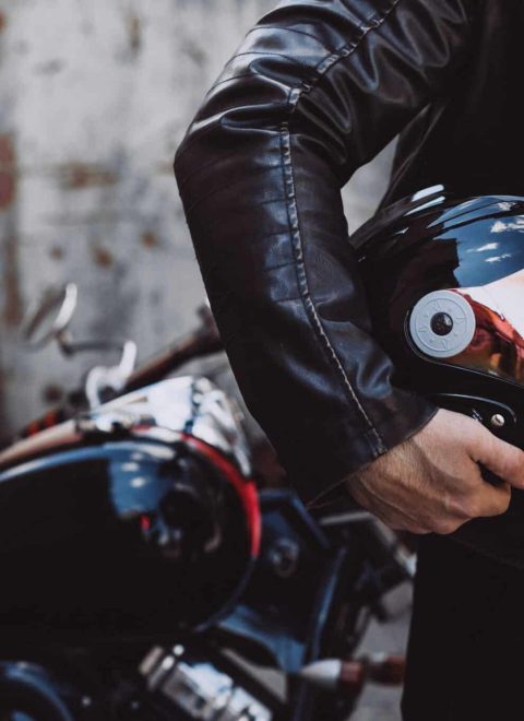 Handsome man biker travelling on mototrcycle